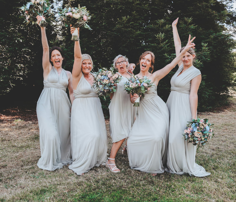 The bridesmaids having an amazing time at the beautiful picture perfect   wedding 